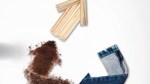 Three arrows going in a circle; the arrows are shown as made from reclaimed denim, spent coffee grounds and used chopsticks. Three arrows going in a circle; the arrows are shown as made from reclaimed denim, spent coffee grounds and used chopsticks.